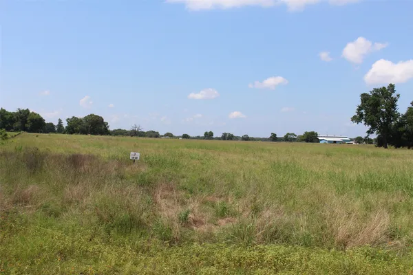 a view of a patio with a lake view