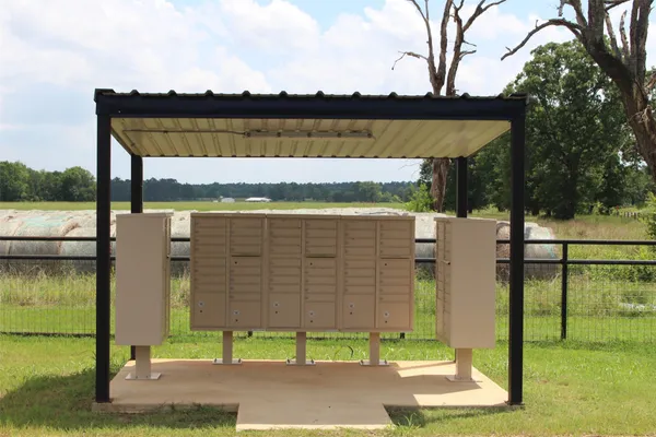 a view of a green field with an outdoor space