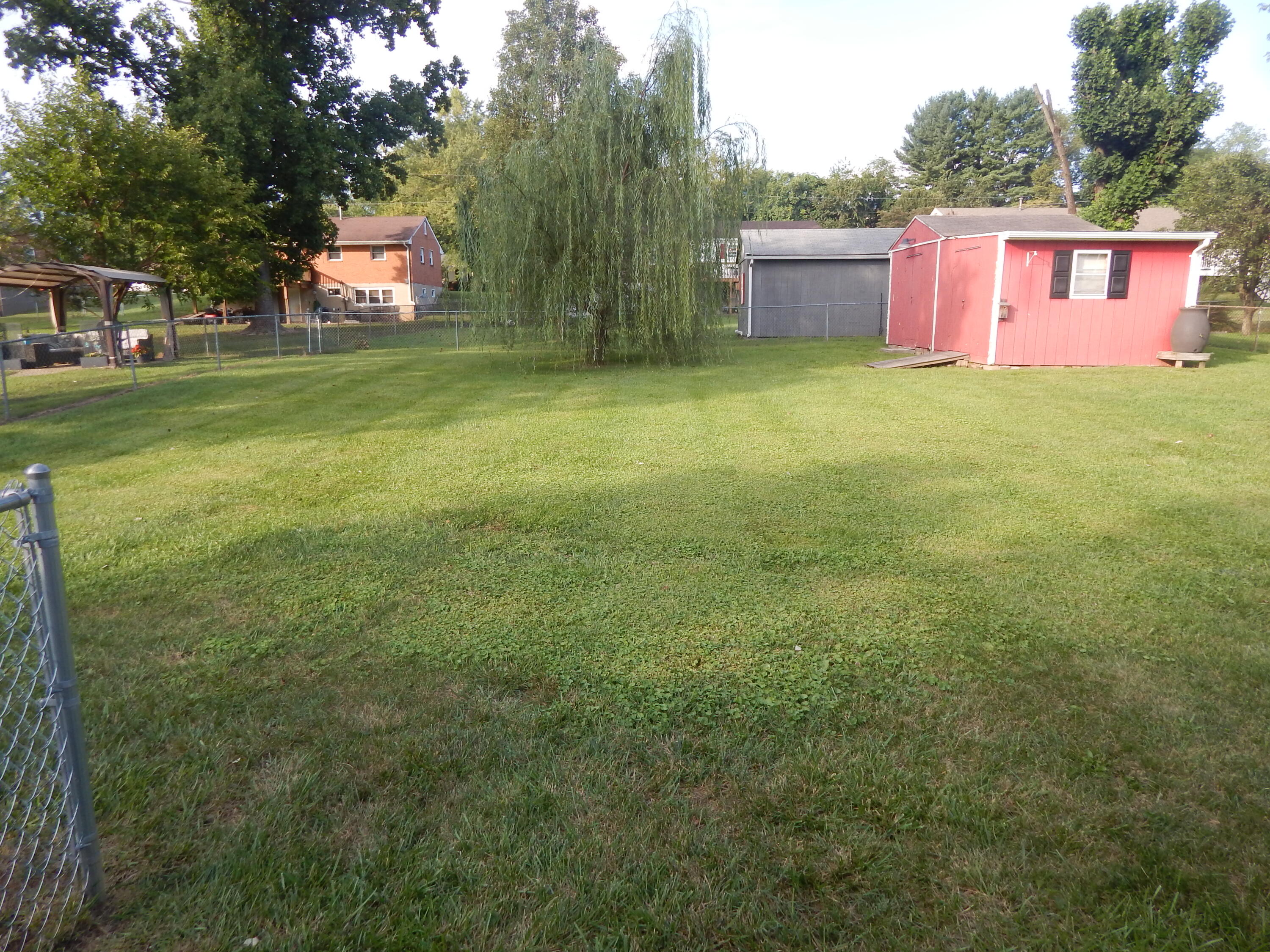513 Holiday Road Vinton, VA 24179 - Photo 3 of 4 a view of a yard with a house in the background