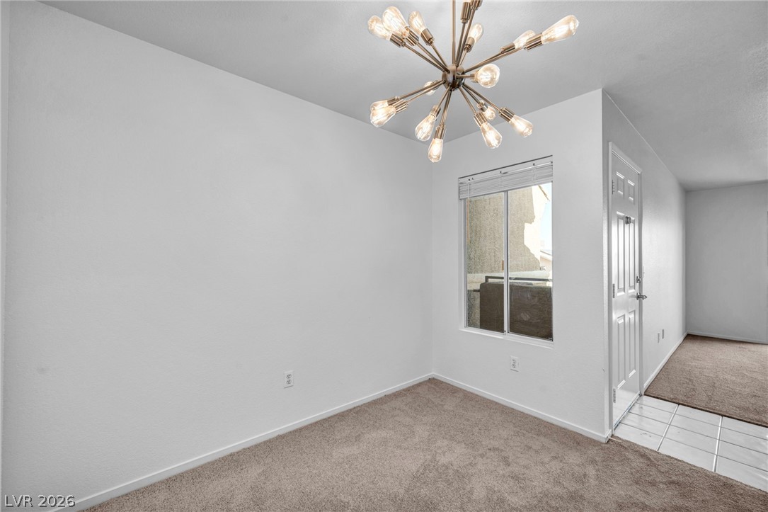 8070 West Russell Road, Unit 2060 Las Vegas, NV 89113 - Photo 22 of 47 This versatile room features natural light and modern lighting, ideal for diverse living arrangements.