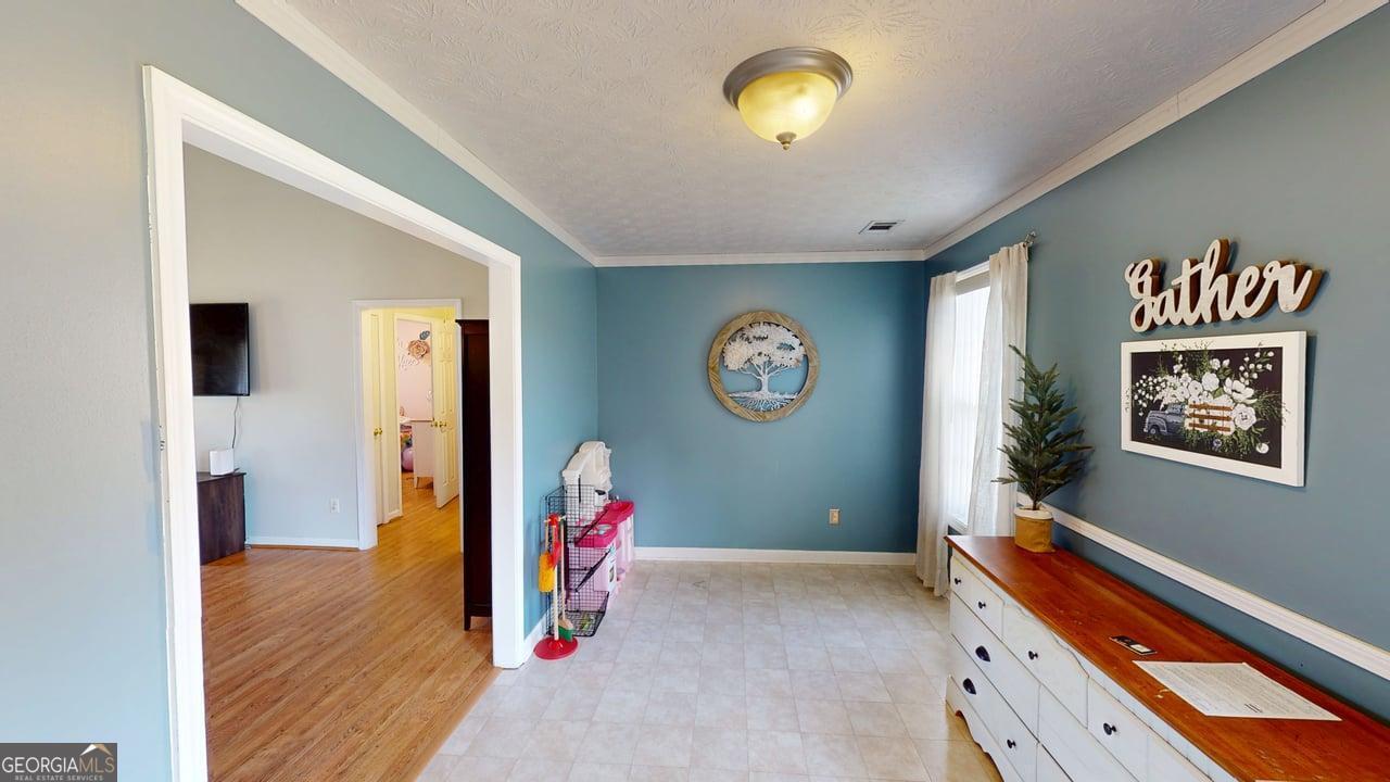 2124 Broad Street Statham, GA 30666 - Photo 12 of 35 a view of an entryway with wooden floor