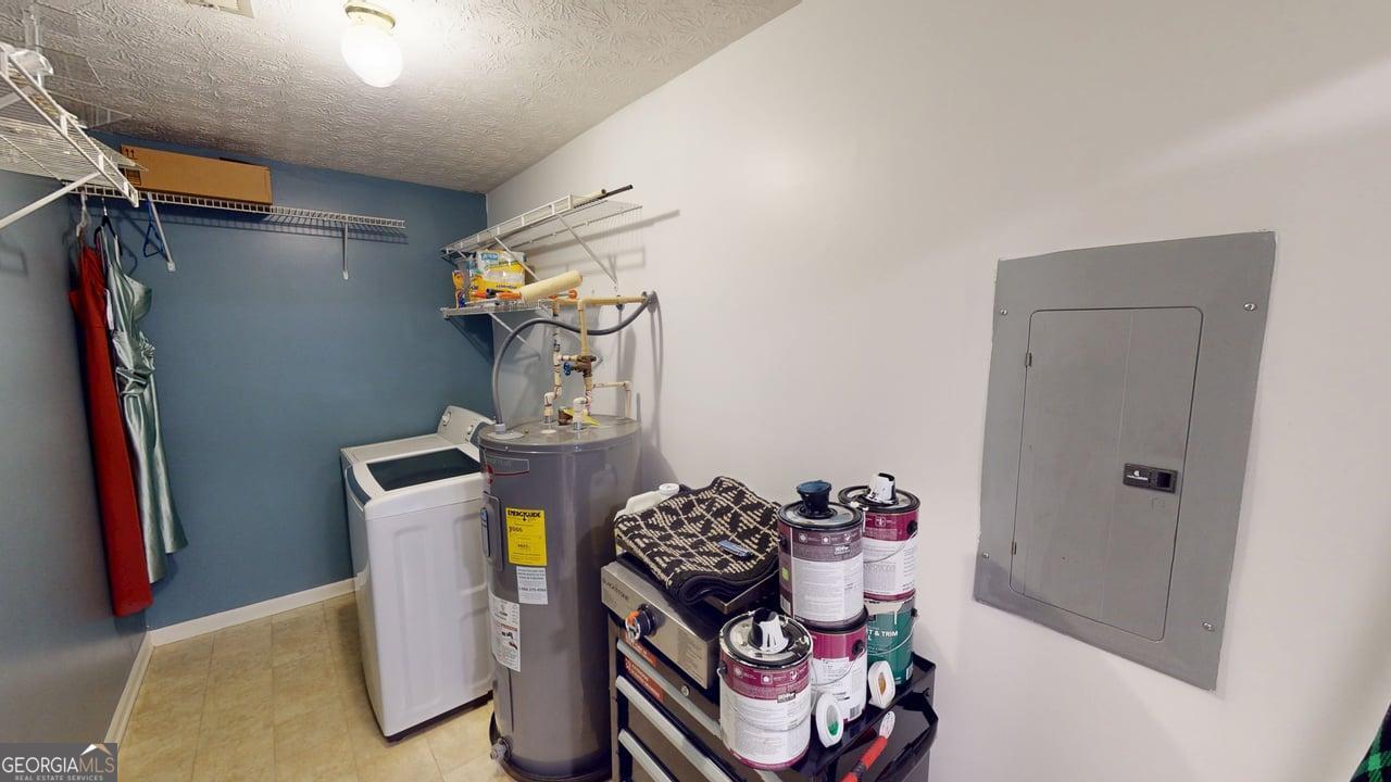2124 Broad Street Statham, GA 30666 - Photo 17 of 35 a bedroom with a bed and a table in it