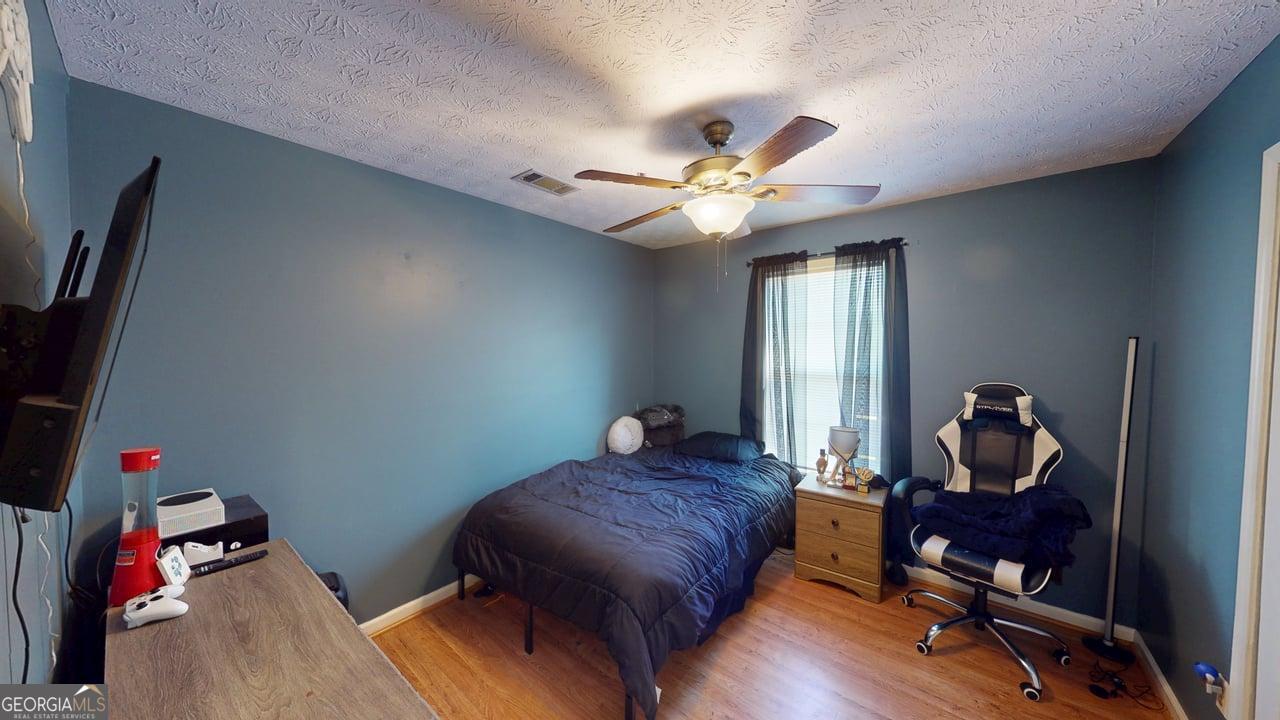 2124 Broad Street Statham, GA 30666 - Photo 24 of 35 a bedroom with furniture and a window