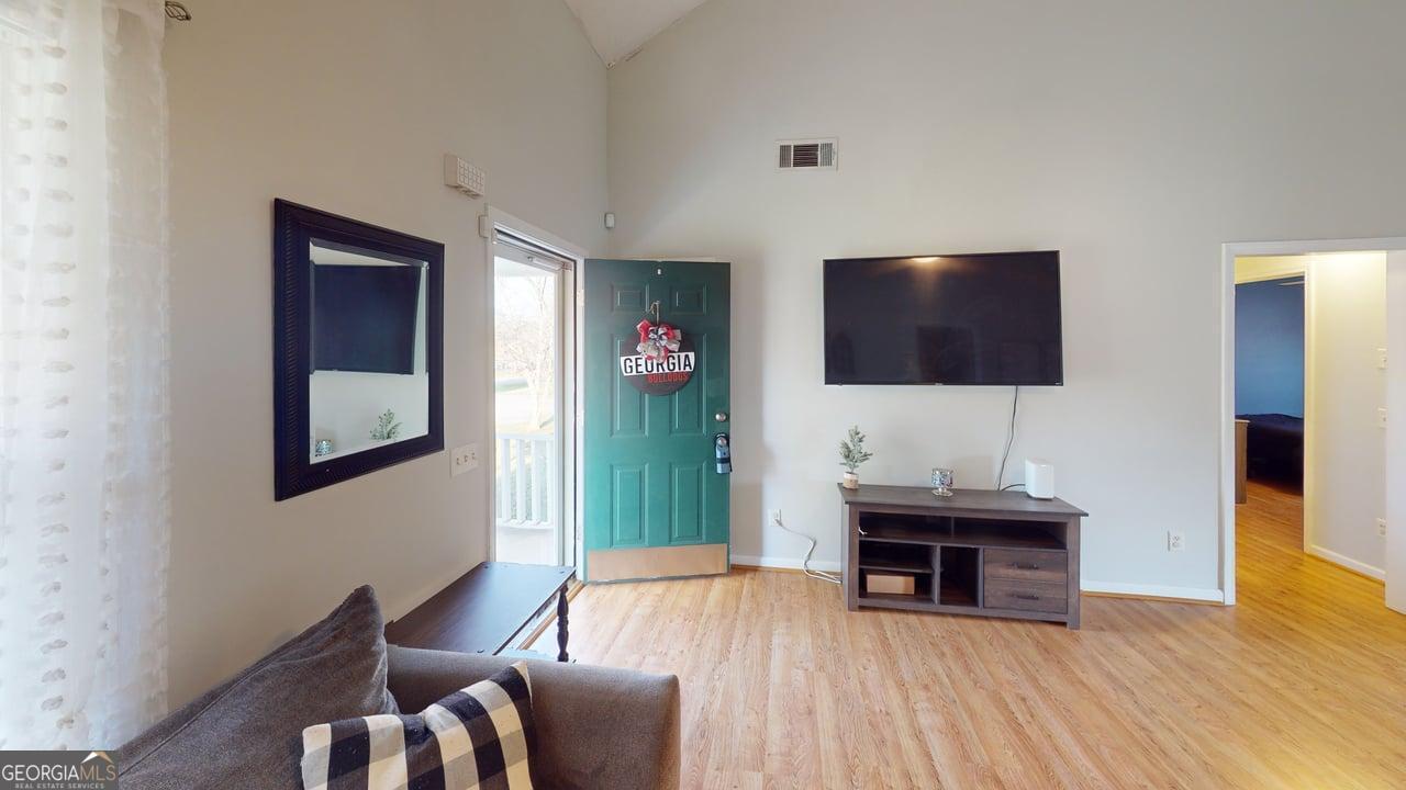 2124 Broad Street Statham, GA 30666 - Photo 5 of 35 a living room with furniture and a flat screen tv
