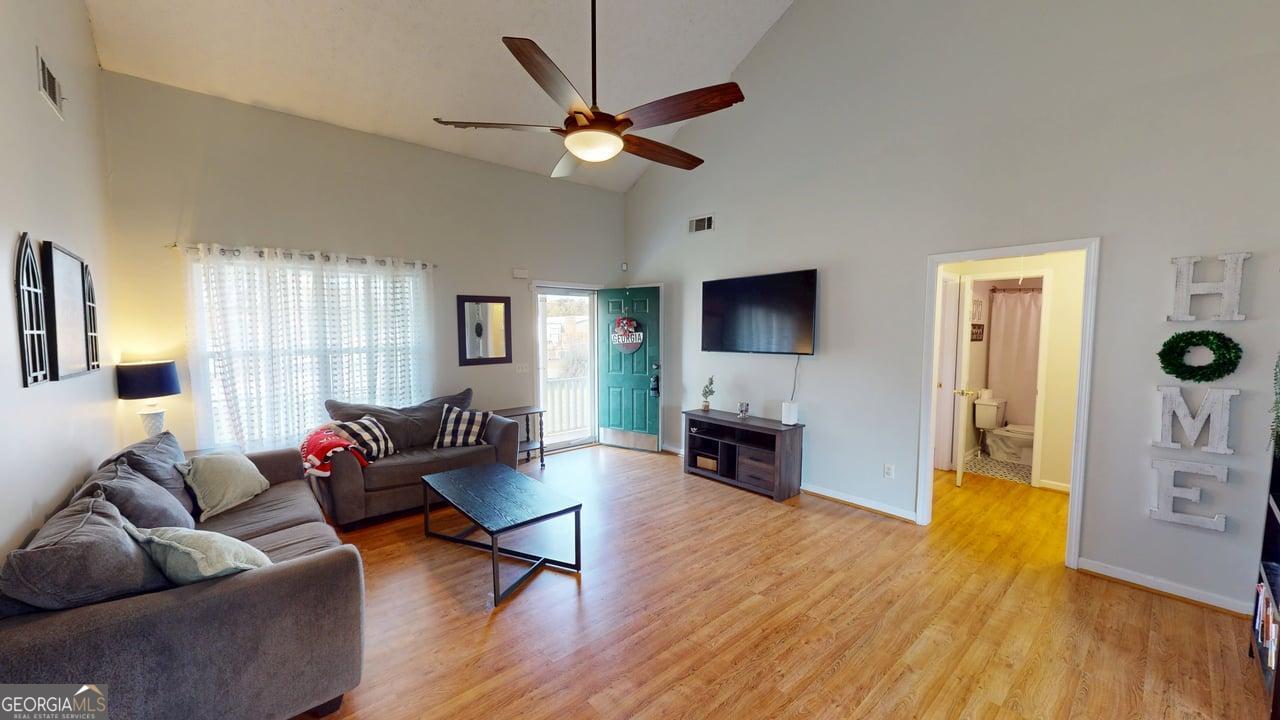2124 Broad Street Statham, GA 30666 - Photo 6 of 35 a living room with furniture and a fireplace
