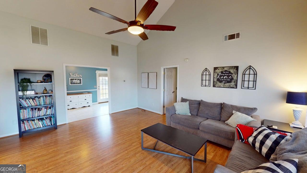 2124 Broad Street Statham, GA 30666 - Photo 7 of 35 a living room with furniture and painting on the wall