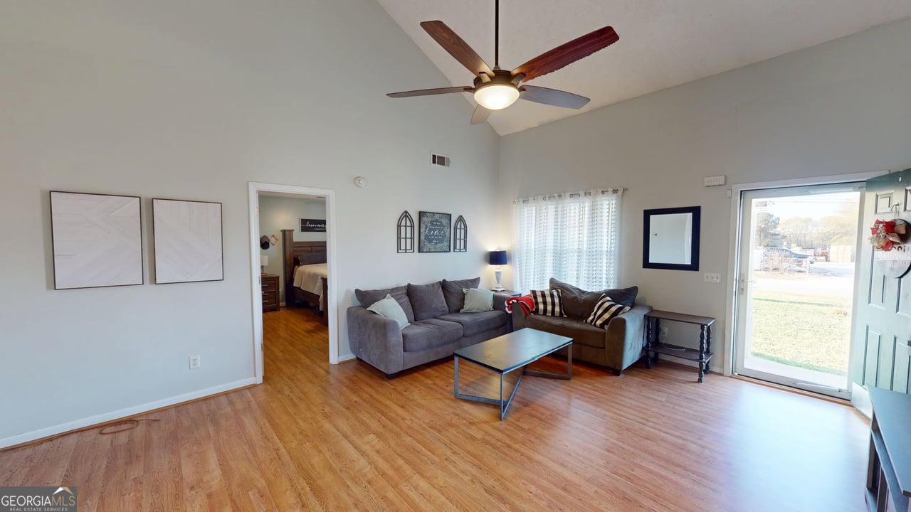 2124 Broad Street Statham, GA 30666 - Photo 8 of 35 a living room with furniture and a large window