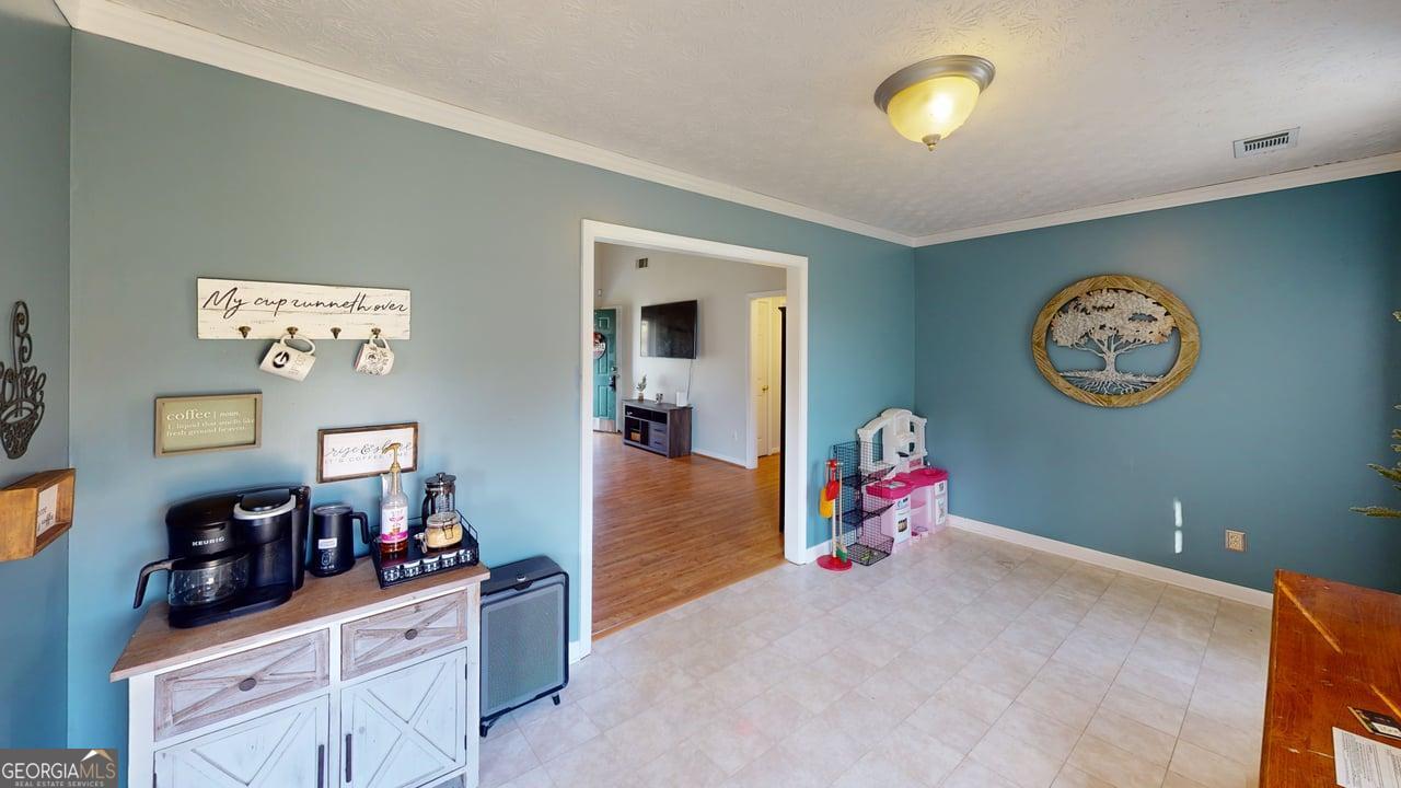 2124 Broad Street Statham, GA 30666 - Photo 10 of 35 a living room with hard wood flooring