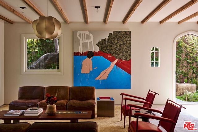 a view of a dining room with furniture window and outside view