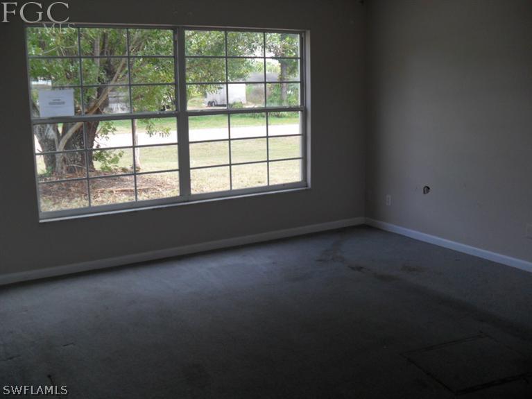 2225 Caladium Road Fort Myers, FL 33905 - Photo 3 of 9 an empty room with a window
