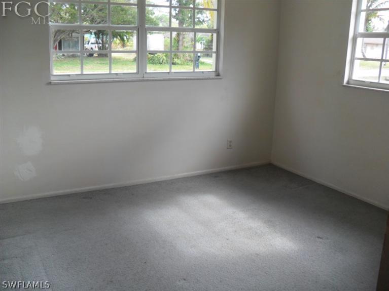 2225 Caladium Road Fort Myers, FL 33905 - Photo 5 of 9 an empty room with a window