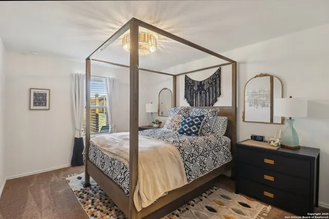 a bedroom with bed and a window