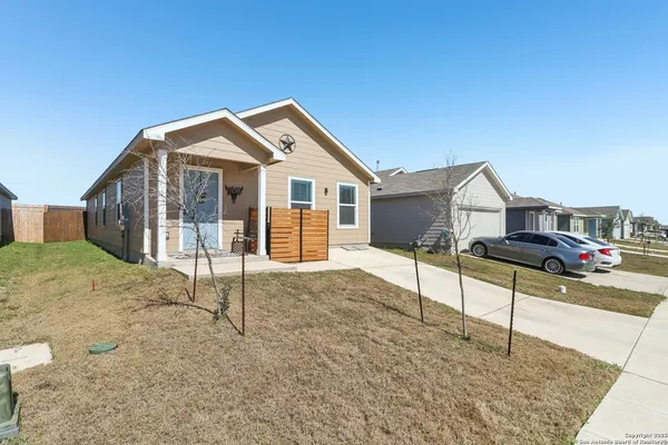 a front view of a house with a yard