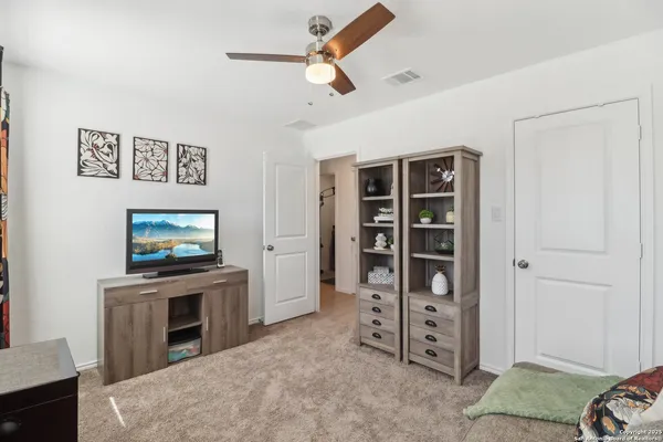 a view of a livingroom with furniture and a flat screen tv