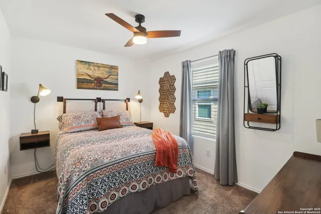 a bedroom with a bed and a mirror