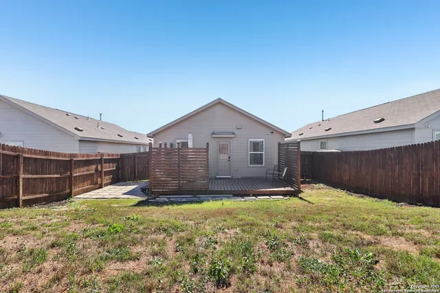 a view of a backyard of the house