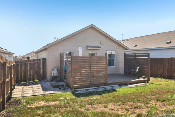 a view of a backyard of the house
