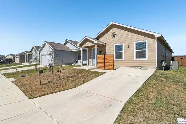 a front view of a house with a yard