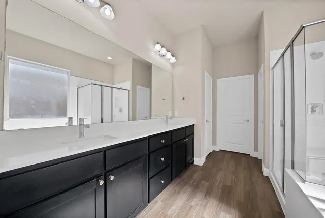 a bathroom with a bathtub and a shower