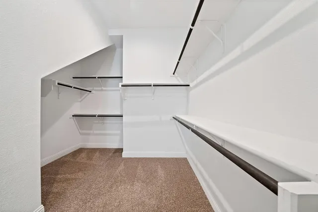 a bathroom with a double vanity sink a mirror and a bathtub