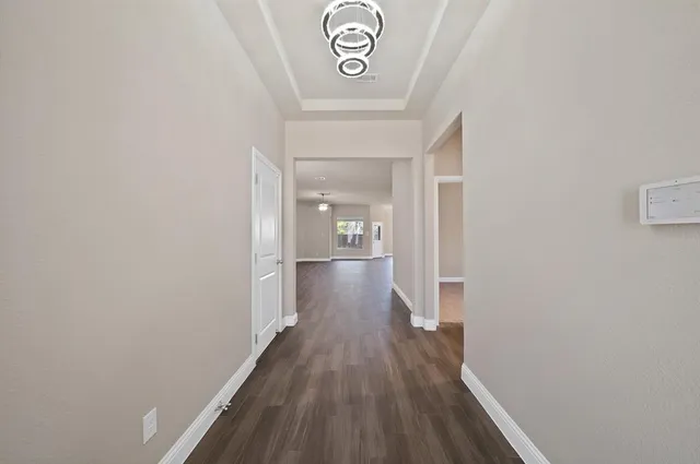 a bathroom with a sink a toilet a tub and a mirror