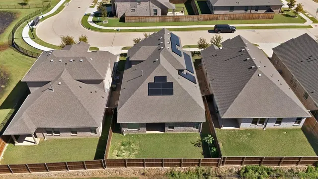 an aerial view of residential building with parking space