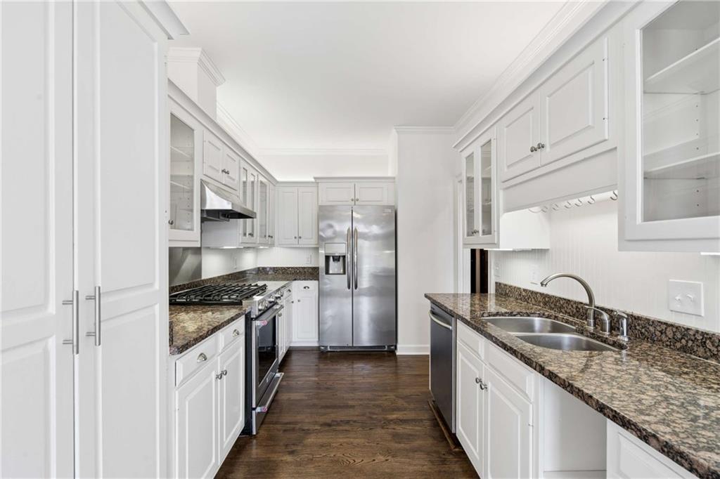 17 Muscogee Way Northwest Atlanta, GA 30305 - Photo 12 of 40 a kitchen with stainless steel appliances granite countertop a sink stove and refrigerator