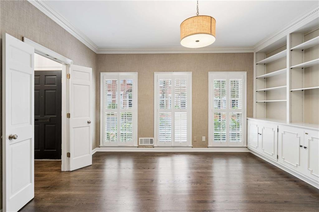 17 Muscogee Way Northwest Atlanta, GA 30305 - Photo 23 of 40 a view of an empty room with wooden floor and windows