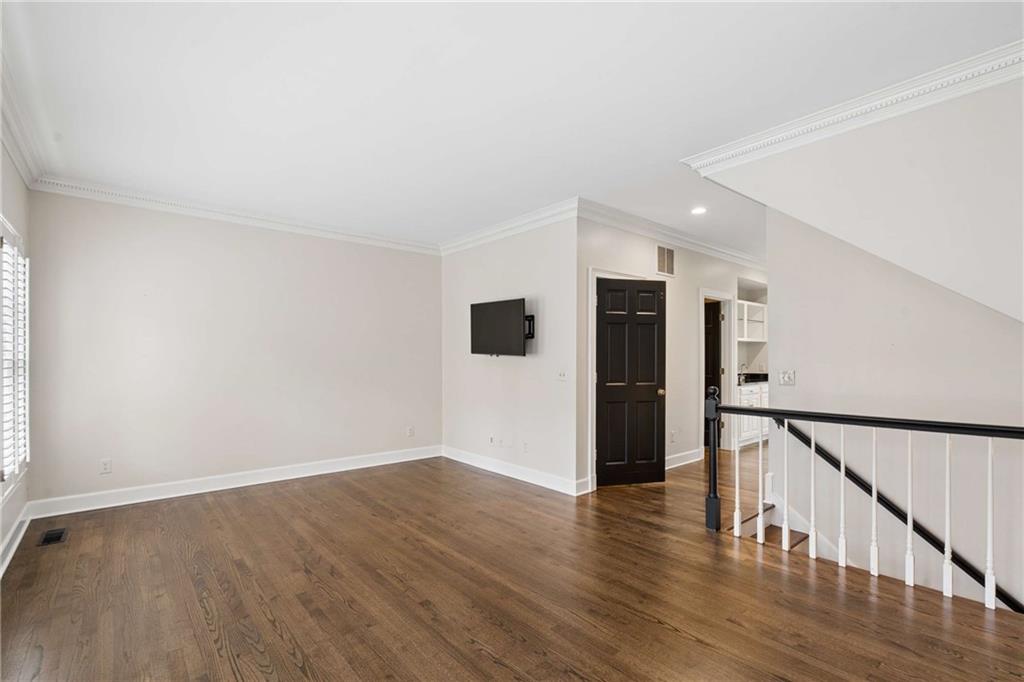 17 Muscogee Way Northwest Atlanta, GA 30305 - Photo 7 of 40 a view of a hallway with wooden floor and staircase