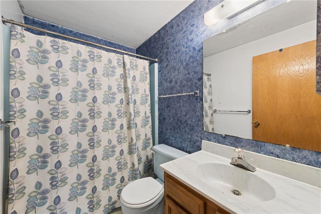 136 Bottom Road Mill Run, PA 15464 - Photo 16 of 26 a bathroom with a sink and a mirror