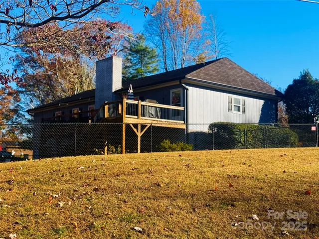 a view of a house with swimming pool