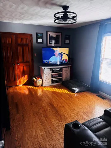 a view of a livingroom with furniture and window