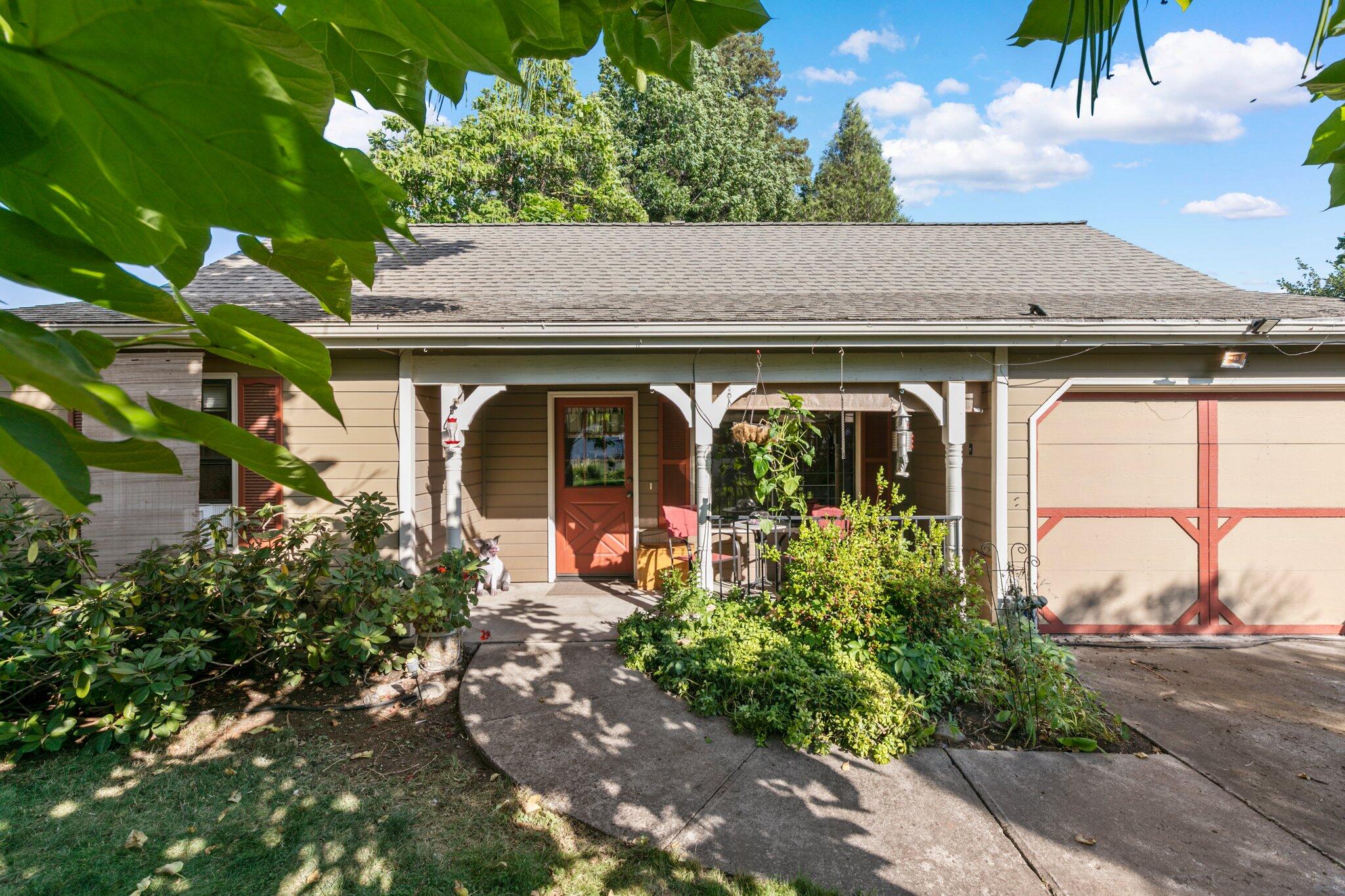 2592 Merriman Road Medford, OR 97501 - Photo 1 of 26 a front view of a house with garden