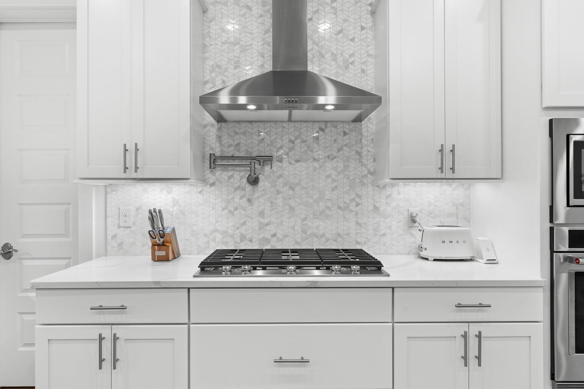 105 Seaboard Lane Santa Rosa Beach, FL 32459 - Photo 13 of 54 a kitchen with a stove and cabinets