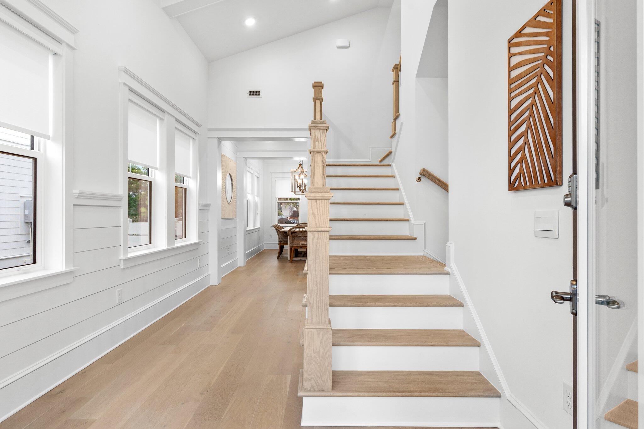 105 Seaboard Lane Santa Rosa Beach, FL 32459 - Photo 21 of 54 a view of entryway with furniture and wooden floor