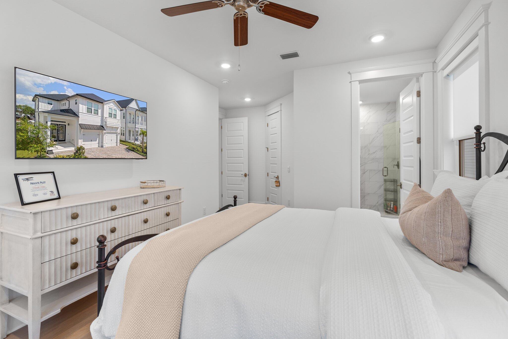 105 Seaboard Lane Santa Rosa Beach, FL 32459 - Photo 27 of 54 a bedroom with a bed and a dresser