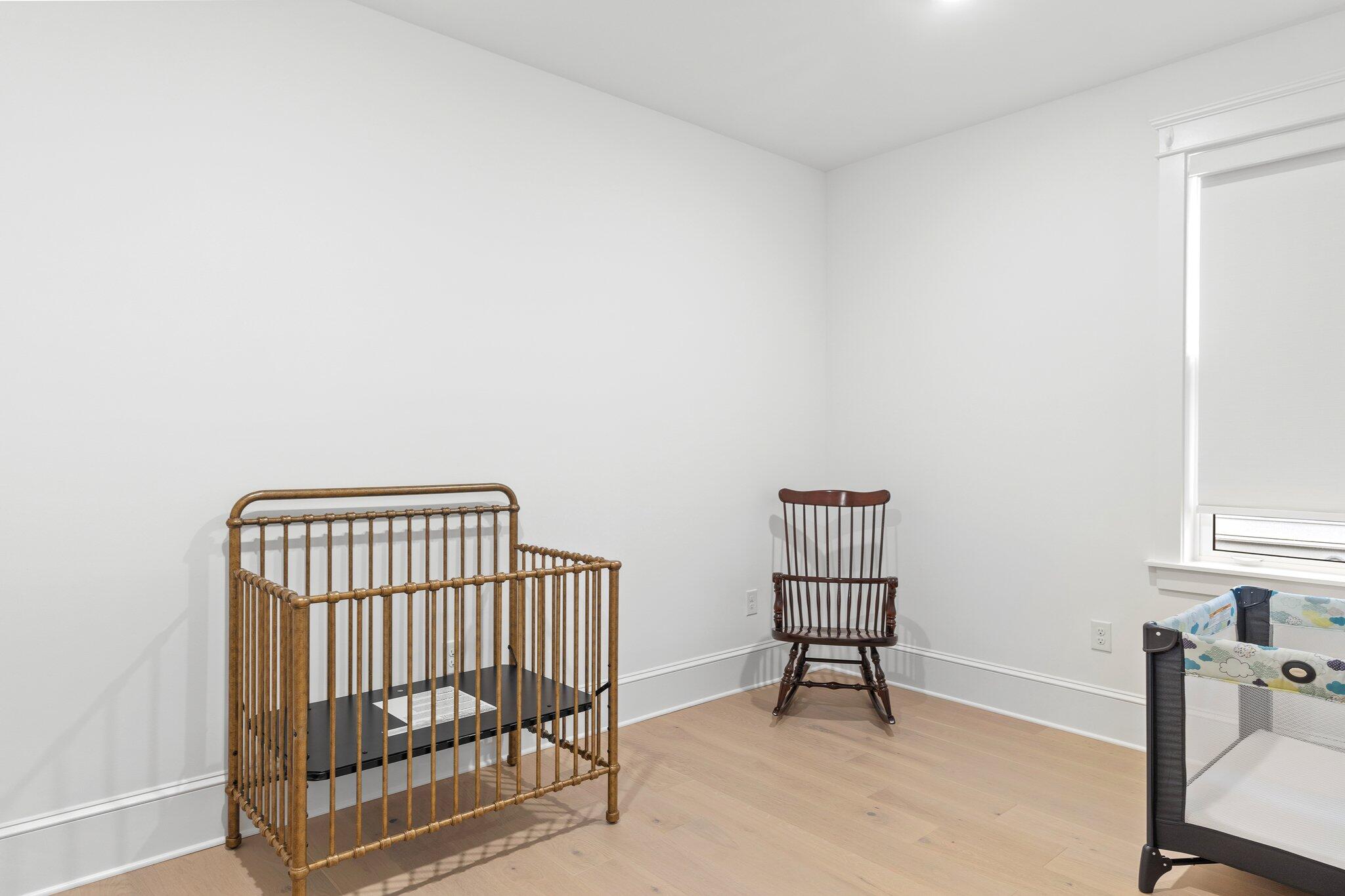 105 Seaboard Lane Santa Rosa Beach, FL 32459 - Photo 28 of 54 a bedroom with a chair and a window