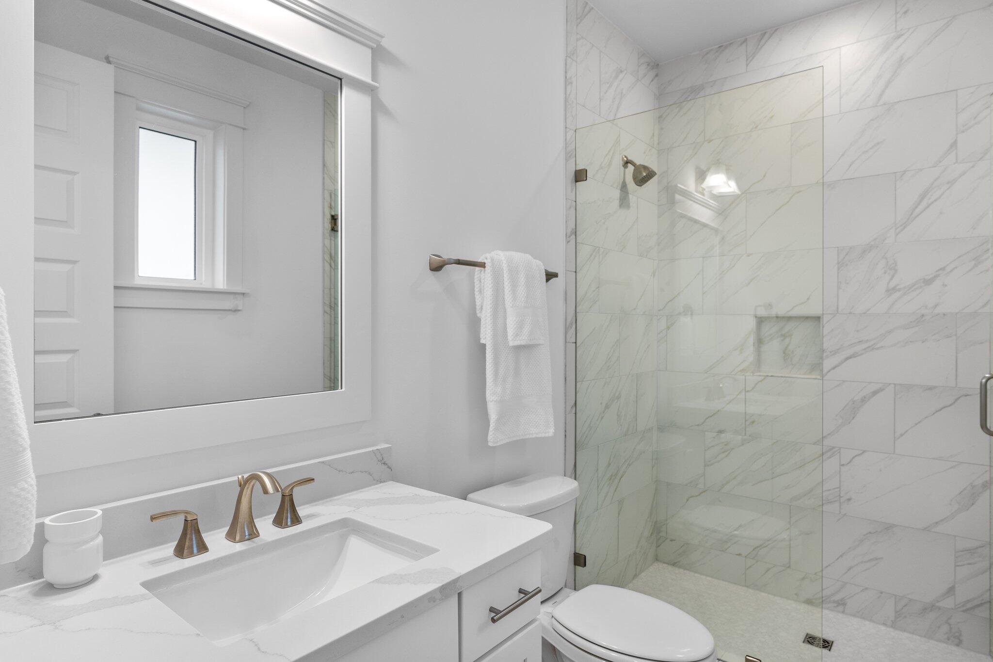 105 Seaboard Lane Santa Rosa Beach, FL 32459 - Photo 30 of 54 a bathroom with a sink toilet and shower