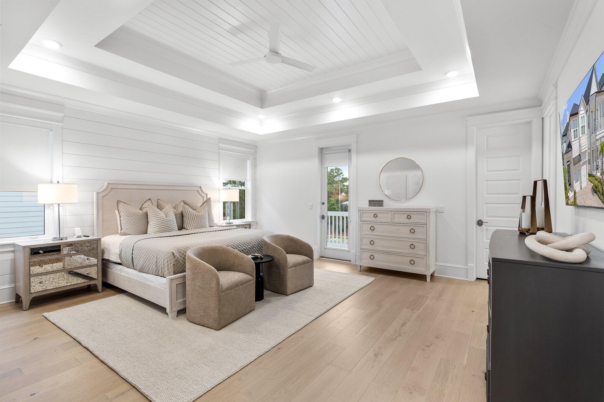 105 Seaboard Lane Santa Rosa Beach, FL 32459 - Photo 32 of 54 a spacious bedroom with a bed a couch and dresser