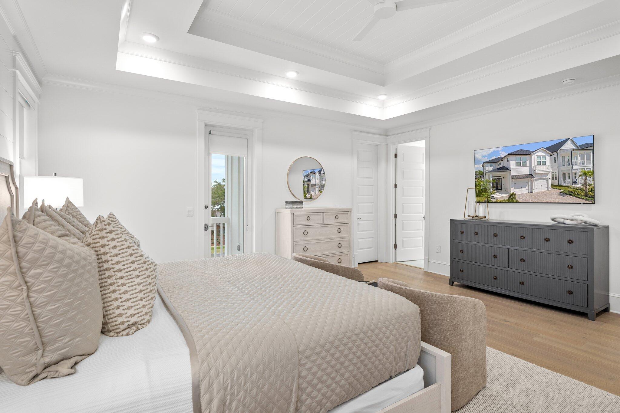 105 Seaboard Lane Santa Rosa Beach, FL 32459 - Photo 34 of 54 a spacious bedroom with a bed and a dresser