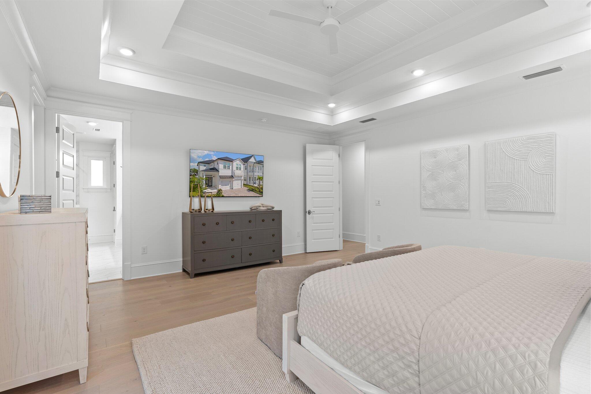 105 Seaboard Lane Santa Rosa Beach, FL 32459 - Photo 35 of 54 a bedroom with a bed and a cabinets