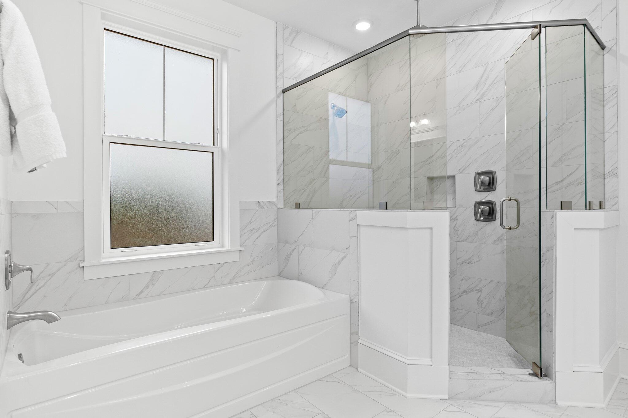 105 Seaboard Lane Santa Rosa Beach, FL 32459 - Photo 39 of 54 a bathroom with a bathtub and a shower