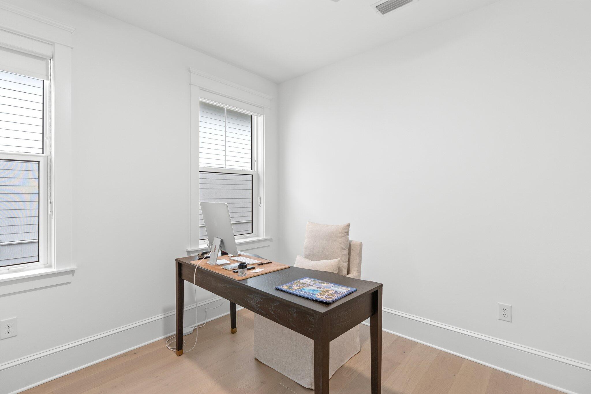 105 Seaboard Lane Santa Rosa Beach, FL 32459 - Photo 40 of 54 a room with a table and a window