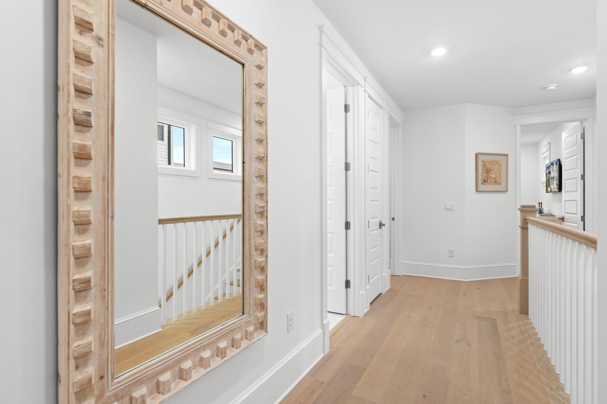105 Seaboard Lane Santa Rosa Beach, FL 32459 - Photo 42 of 54 a view of a hallway with wooden floor and entryway