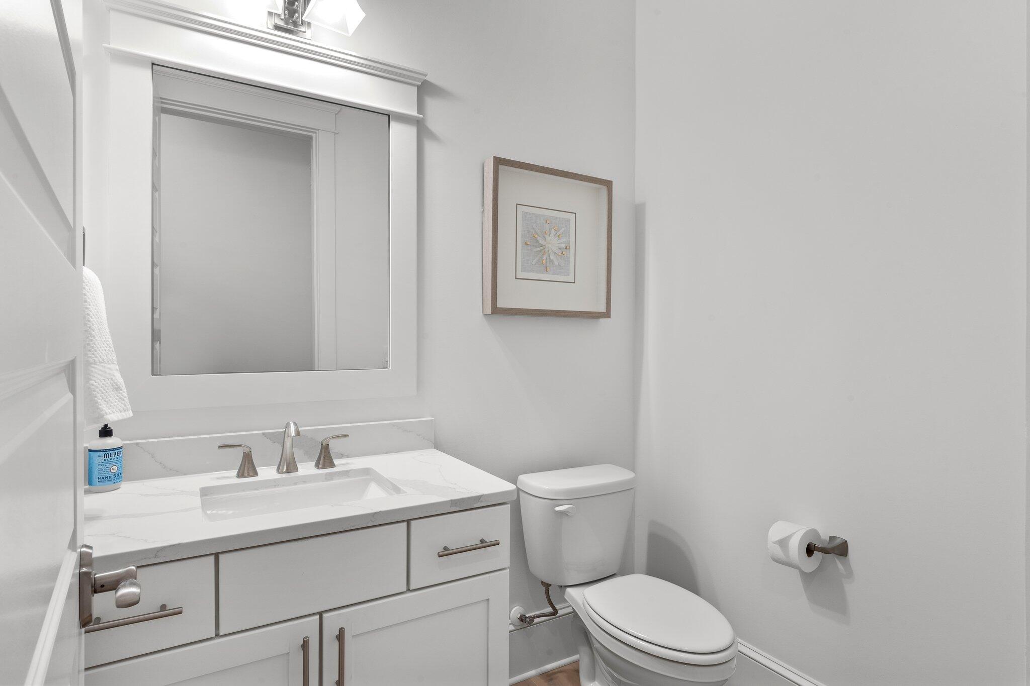 105 Seaboard Lane Santa Rosa Beach, FL 32459 - Photo 45 of 54 a bathroom with a sink mirror vanity and toilet