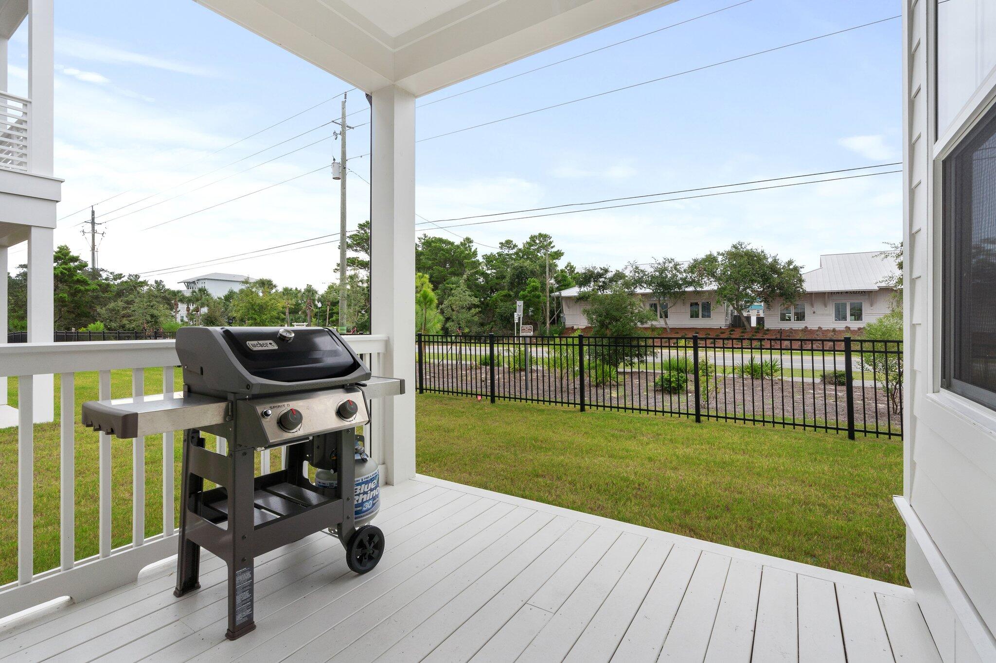 105 Seaboard Lane Santa Rosa Beach, FL 32459 - Photo 46 of 54 a view of a deck with couches with wooden floor and fence