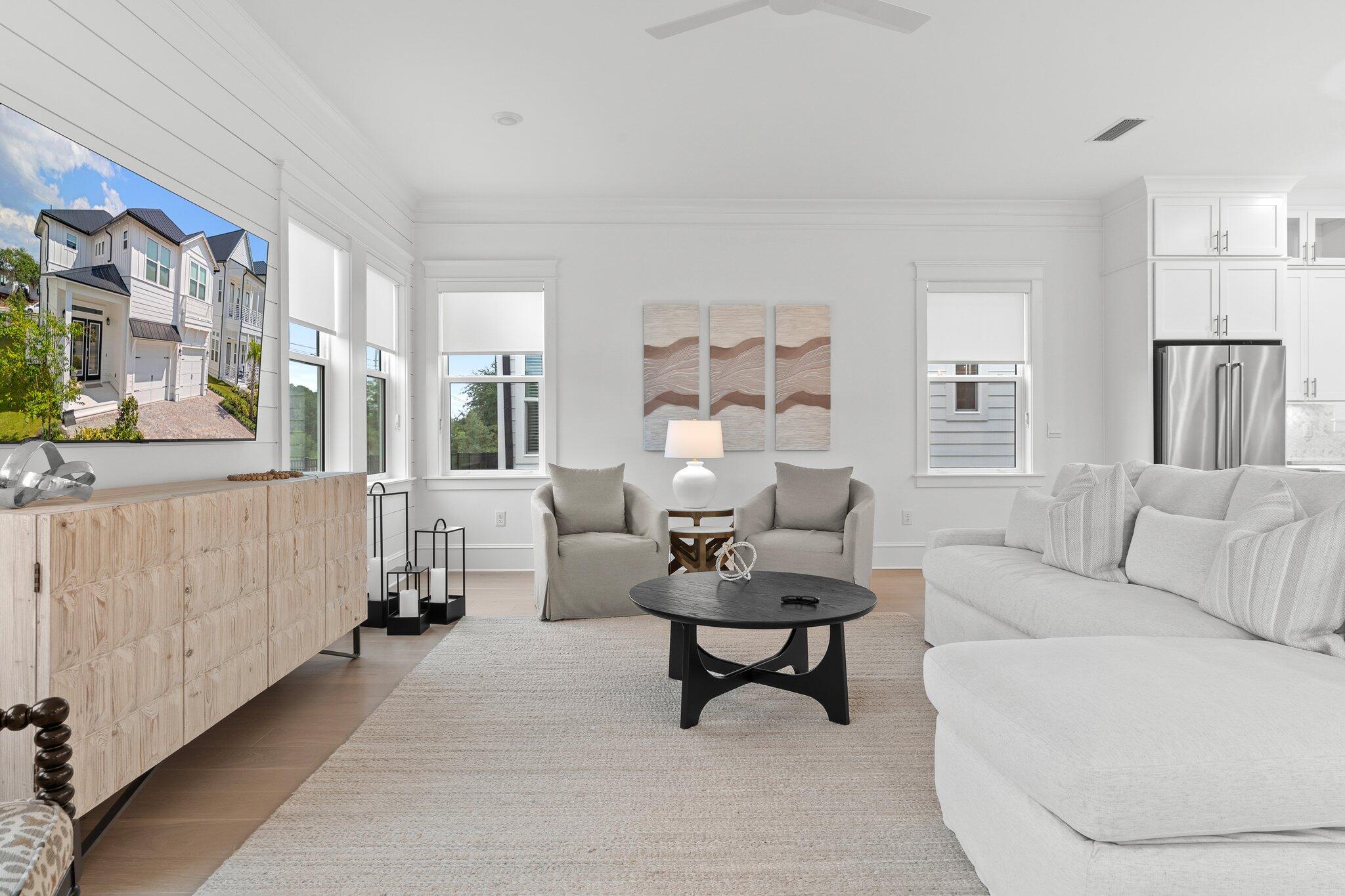 105 Seaboard Lane Santa Rosa Beach, FL 32459 - Photo 5 of 54 a living room with furniture and a large window