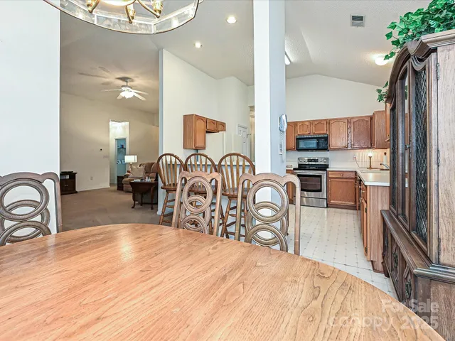 a bedroom with furniture a bed and a mirror