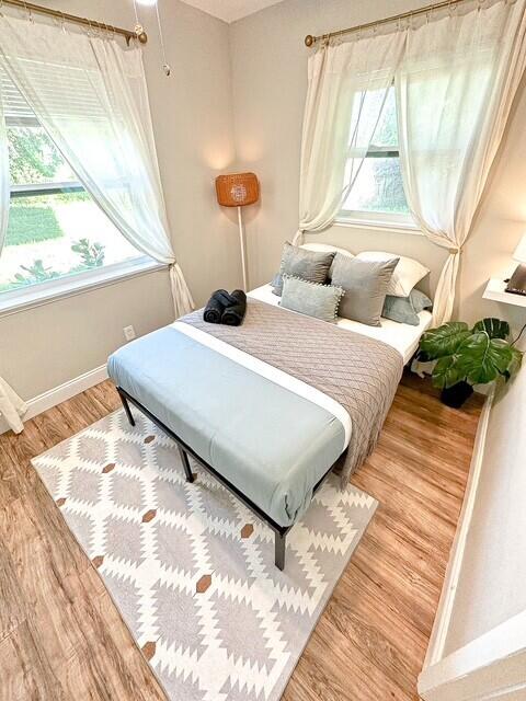 325 Southwest 4th Avenue Delray Beach, FL 33444 - Photo 11 of 16 a bedroom with a bed and a large window