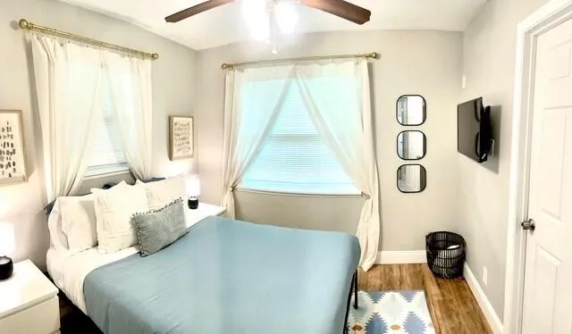 a bedroom with a bed and a window